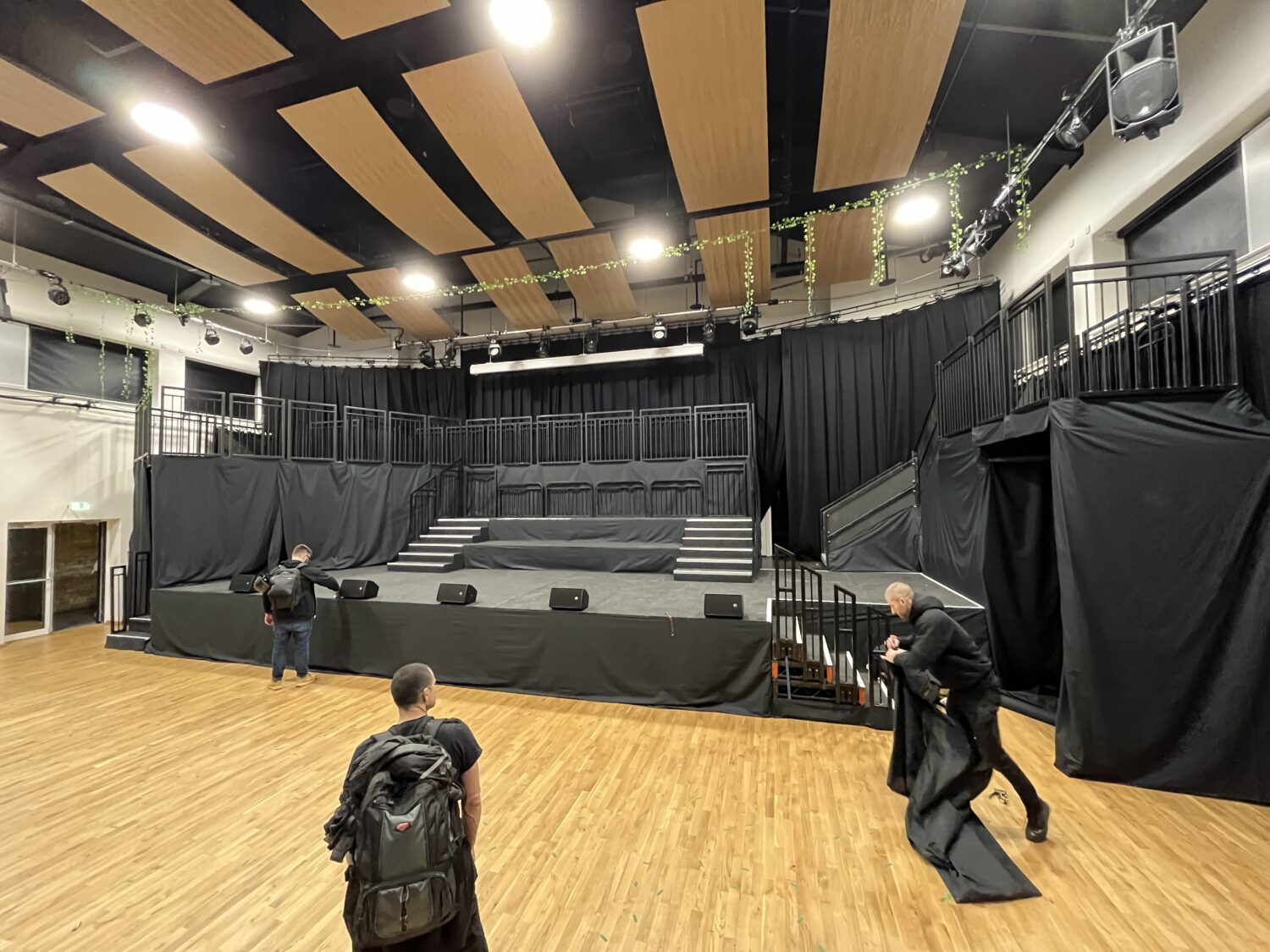 Custom multi-level Steeldeck stage with orchestra platform and castle-style balcony for school theatre production.